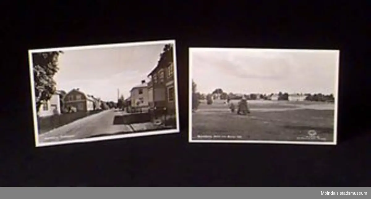 Två vykort. Fotomotiv från Malmköping. Två olika stadsmiljöer. I nedre höger hörn står tryckt "Äkta fotografi. Foto och ensamrätt: A/B Almquist & Cöster, Hälsingborg".Givaren var son till ägaren.