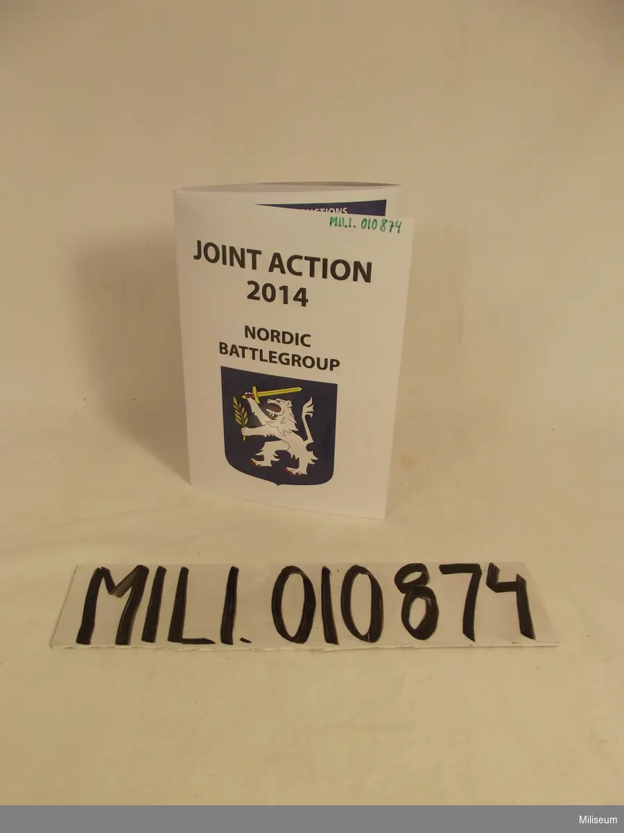 Broschyr med information om "joint Action 2014" som var en storövning med Nordic Battlegroup