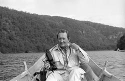 Elvebåt i landskap.