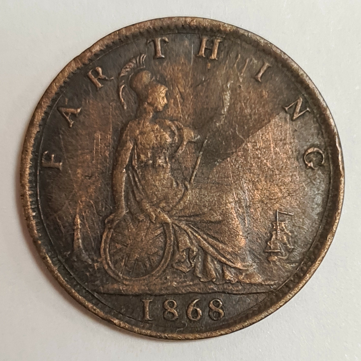 Ett mynt från Storbritanien/England.
Farthing 1868