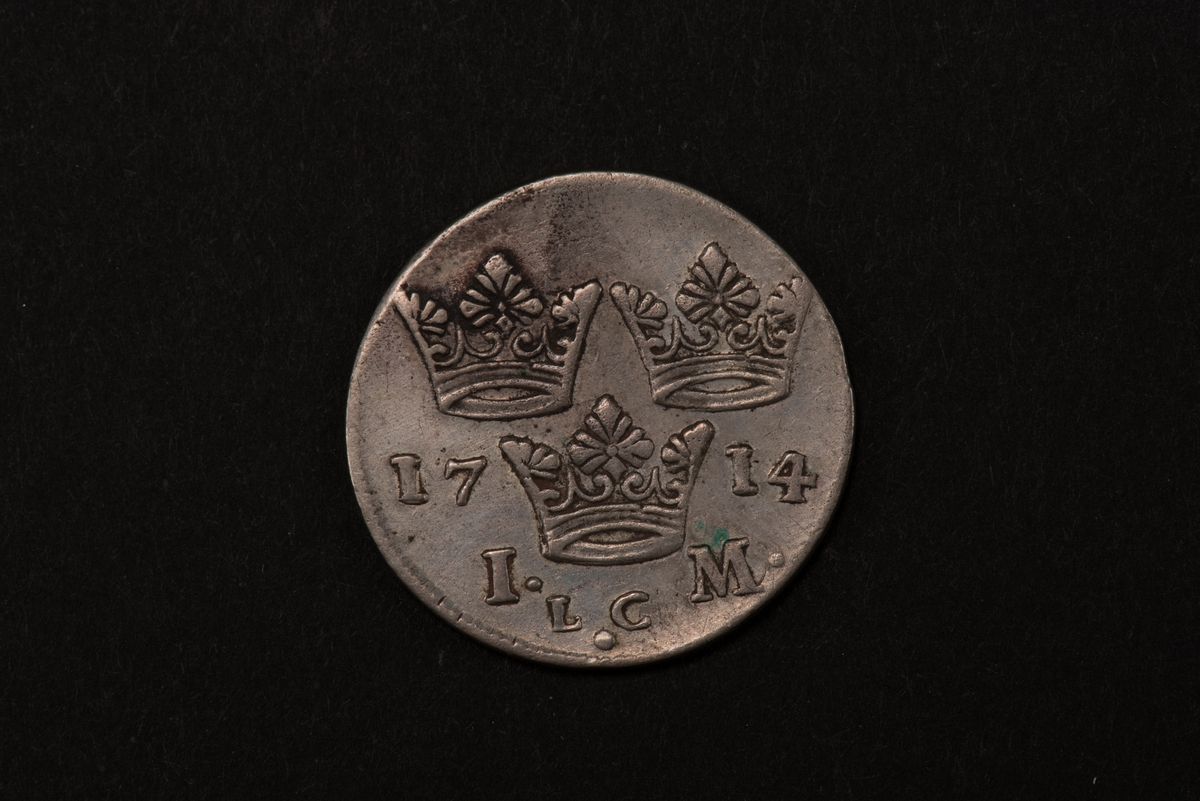 Ett silvermynt med valören 1 mark.