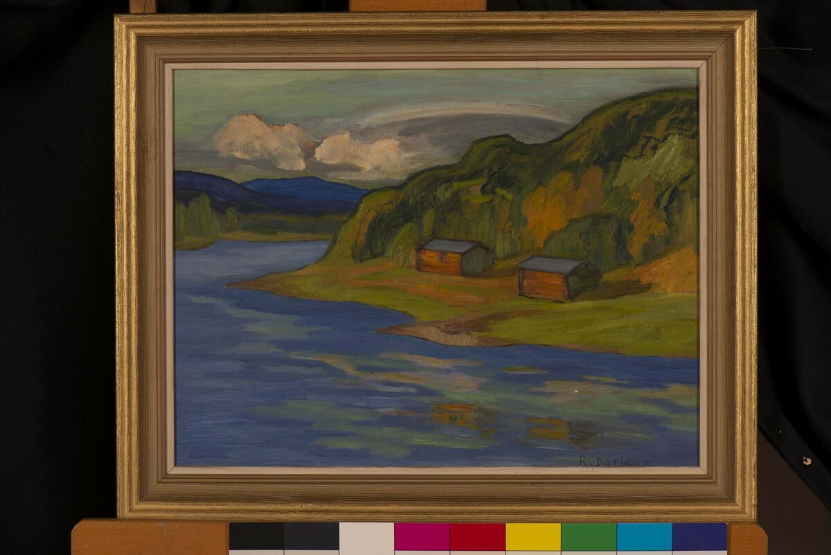 En tavla med ett landskapsmotiv av R. Danielsson.