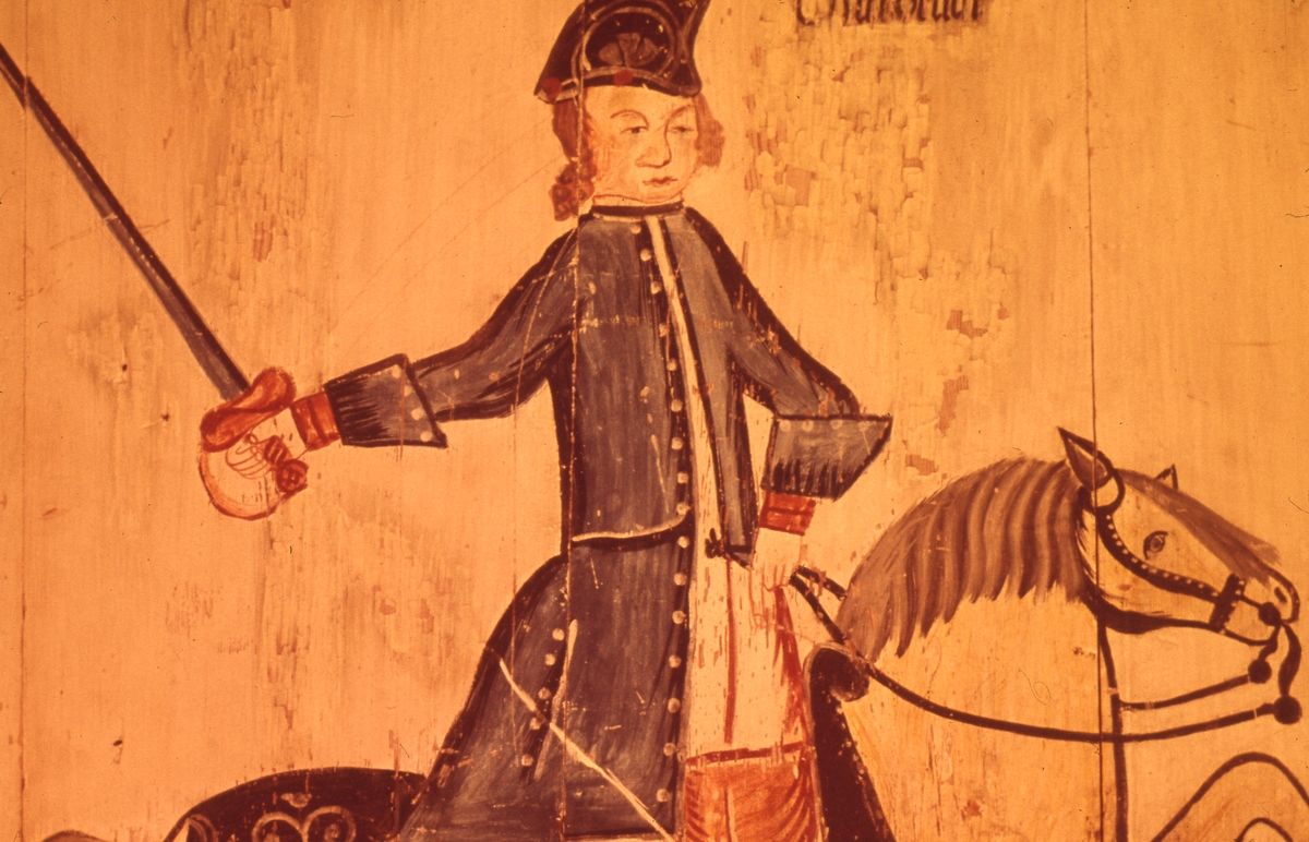 Detalj från väggmålning av Gusaf Reuter. Motivet är en karolin till häst.