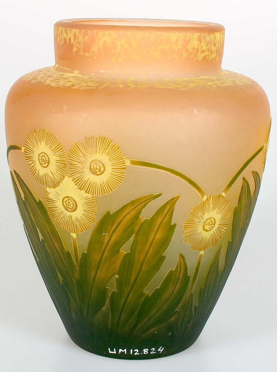 Orange vas med gula blommor och gröna blad. Gul färg fläckvis på skuldran. Signerad: Reijmyre, A.E Boman, 1913, G Welander, No 294, UNIK.