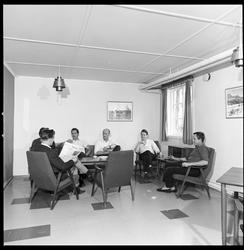 Tilflyttere, oppholdsrom i hybelhus.