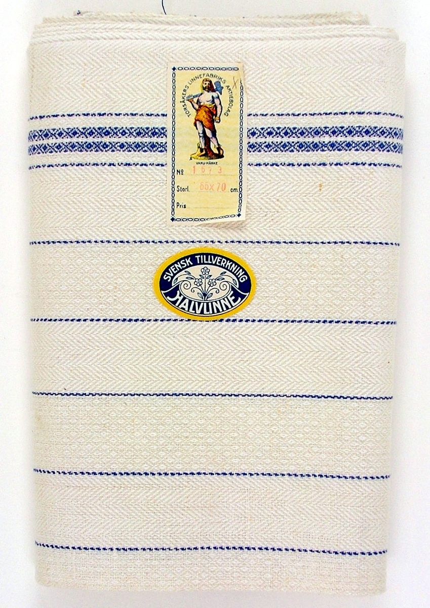 Oklippt, maskinvävd handduksväv av halvlinne tillverkad vid Torsåkers linnefabriks aktiebolag. Verksam omkring 1923-1957 (med viss reservation)
Vävd i kypertvariatinern med naturfärgad botten med blå effektränder.
Försedd med pappersetiketter med tillverkarens emblem