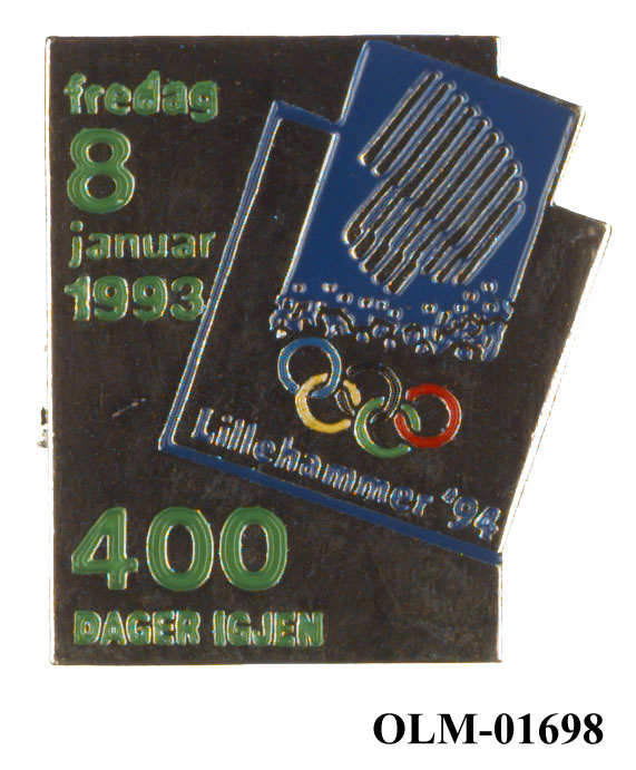 Jakkemerke av metall som viser antall dager igjen til vinter-OL på Lillehammer i 1994. Skråstilt emblem for Lillehammer '94