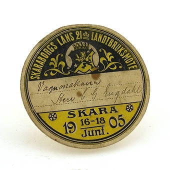 Skaraborgs läns 21:a landtbruksmöte Skara 16-18 juni 1905. Eventuellt mötes- och styrelsemärke.
