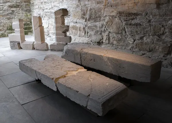 Medieval tombstones and fragment of an old window on display in our lapidarium.