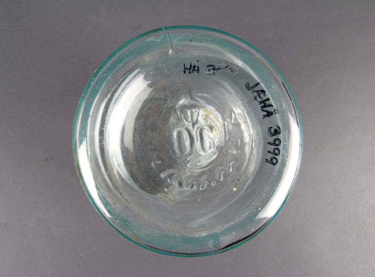 Glasskrukke med støpt påskrift