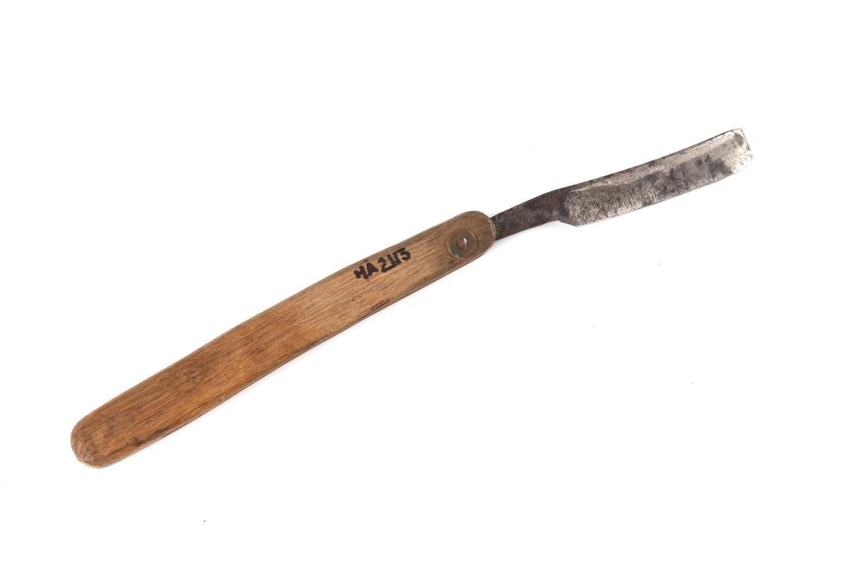 Barberkniv med knivblad som kan foldes inn i håndtaket.