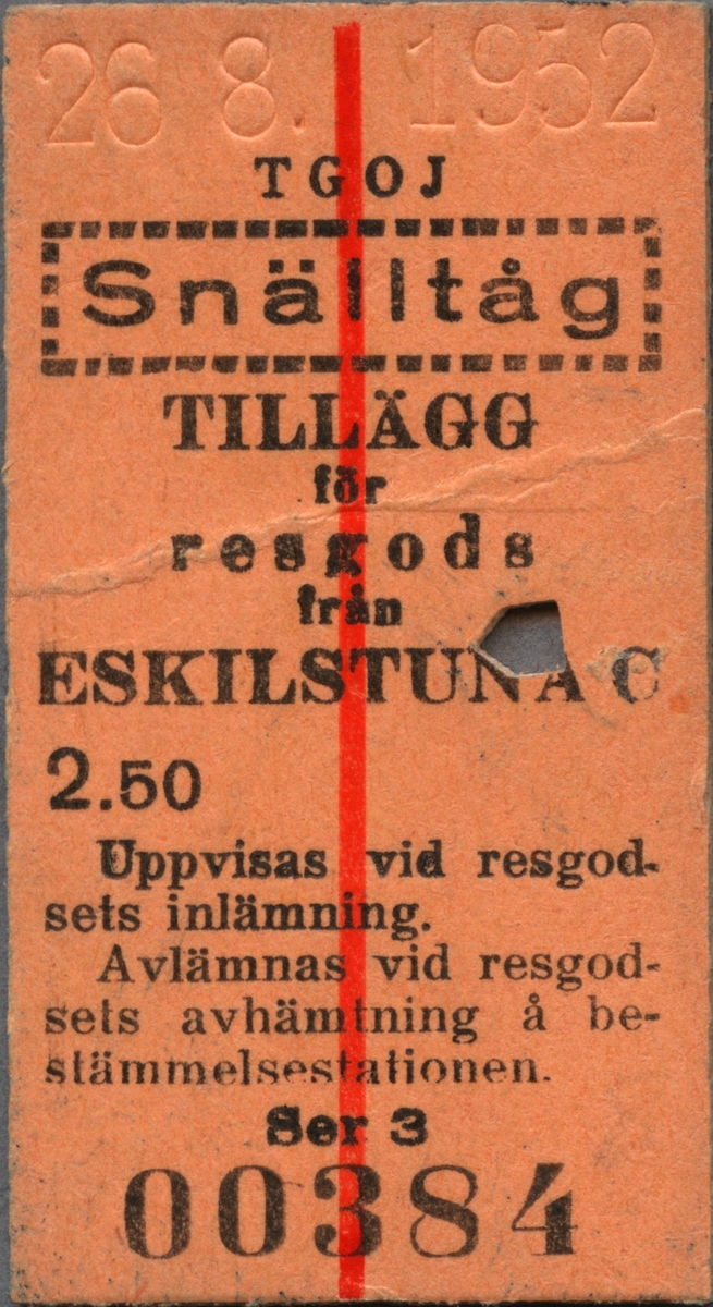 Brun Edmonsonsk biljett med tryckt text i svart:
"TGOJ Snälltåg
TILLÄGG för resgods från ESKILSTUNA C 2.50
Uppvisas vid resgodsets inlämning. Avlämnas vid resgodsets avhämtning å bestämmelsestationen.".
Biljetten har datumet "14.5.1953" präglat längst upp och "snälltåg" står innanför en streckad ram. På mitten, uppifrån och ner löper ett rött streck. Längst ner står biljettnumret "00384". En biljettång har stansat ett hål. 

Historik: TGOJ är förkortning för Trafikförvaltningen Grängesberg-Oxelösunds Järnväg.