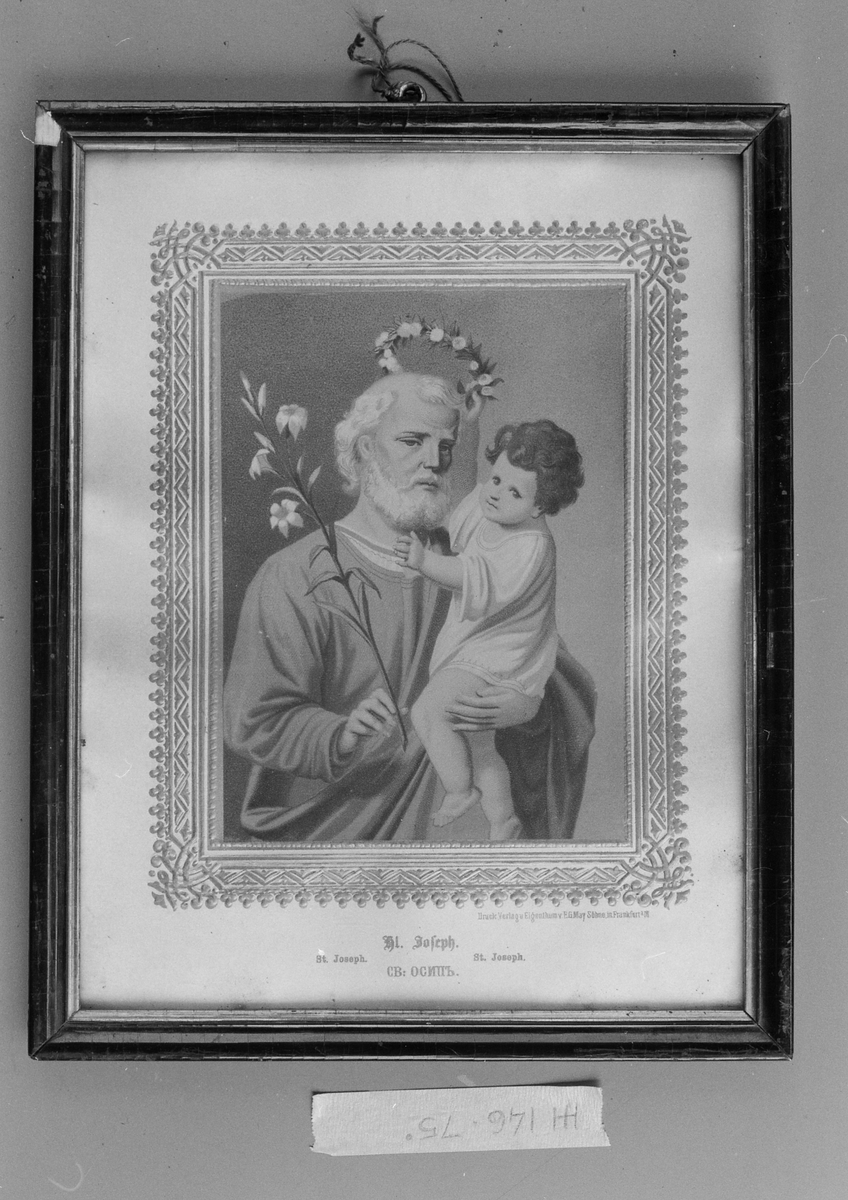 Josef med liten gutt på armen