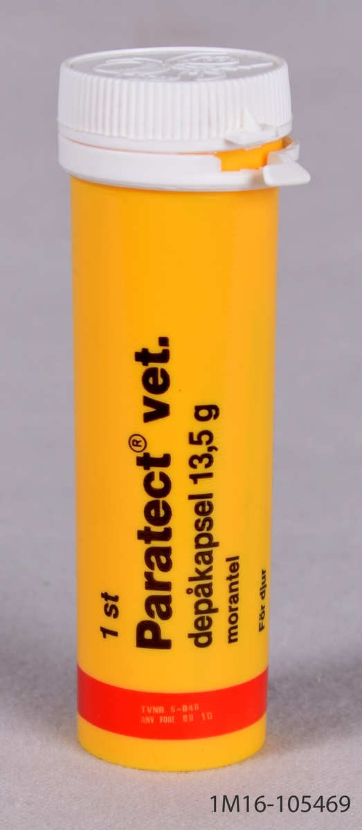Förpackning för avmaskningsmedel. Cyliderformat, gult rör med vitt plastlock.