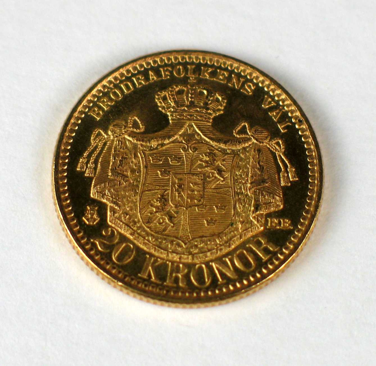 En 20-krone i gull med Oscar II's portrett.