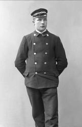 Portrett, mann i portieruniform. Petter Olsen.