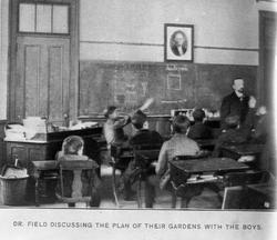 Dr. Field discussing the plan of their gardens with the boys