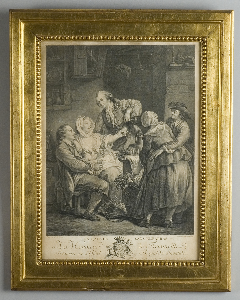 Krogscen med två kvinnor och tre män som sitter, dricker, står och talar runt ett bord.  I förgrunden en stor korg med grönsaker.