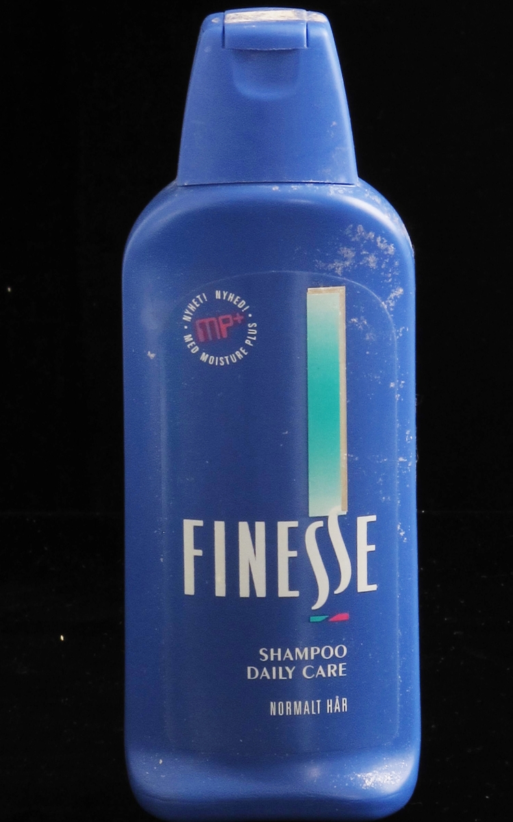 Plastfalske for hårshampoo. Blå flaske, kork med klikklukning.