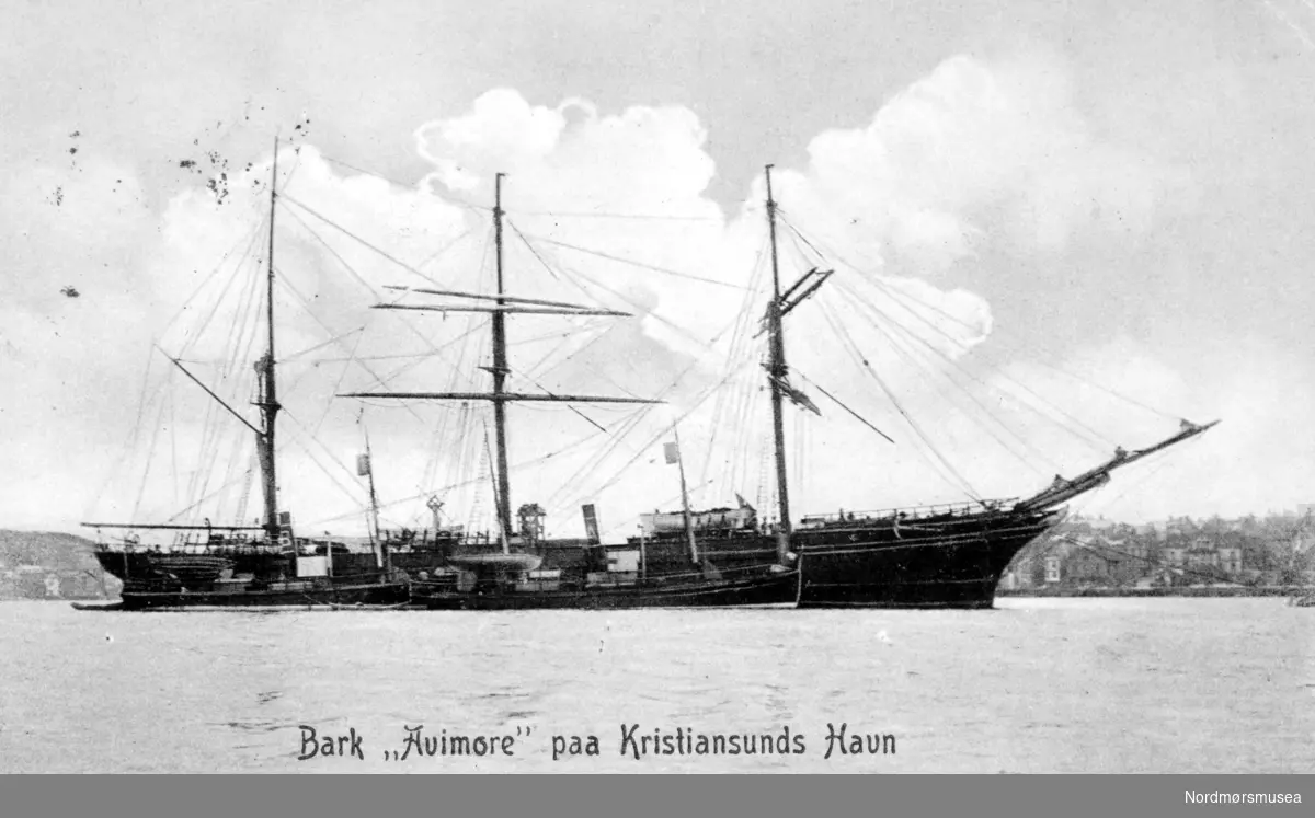 The picture shows AVIEMORE during the period 1905-08 when the ship was active as one of the early floating whale factories at Spitsbergen for Hvalfangerselskabet Alfa & Beta from Sandefjord. The two ships in front should be the whalecatchers ALFA and BETA - obviously distinguished by the funnel signs A and B, a rather unique approach I have not seen applied elsewhere. (Info: Axel Kuehn). - 
Postkort:
";Bark ";Avimore"; paa Kristiansunds havn."; Motiv av barken ";Avimore";, en norsk seilskute bygget i 1870. Skuten forsvant i Atlanteren i november 1917 under en reise fra Halifax-NS til Liverpool med trelast (kilde: www.wrecksite.eu). Fra Nordmøre museums fotosamlinger.