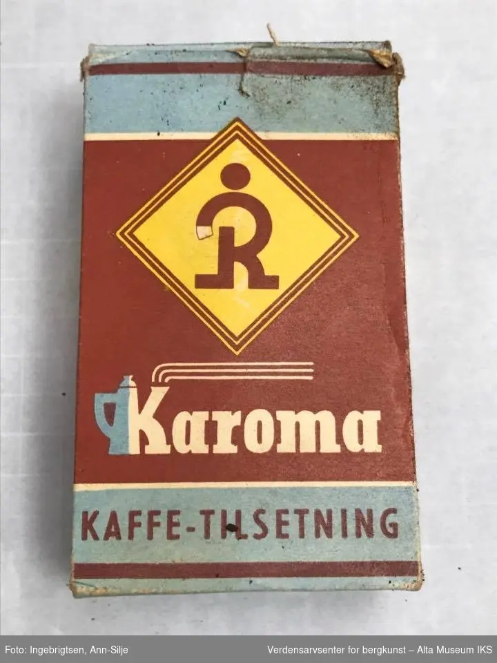 Form: Emballasje til kaffetilsetning. Logoen består av en stor R med prikk over i en gul firkant.