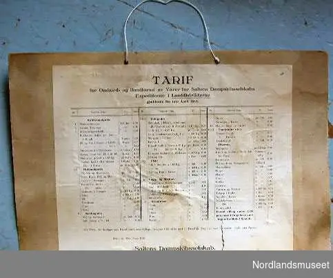 Tariff for ombord og i landførsel fra 1.2.1923. Papir limt på papp.