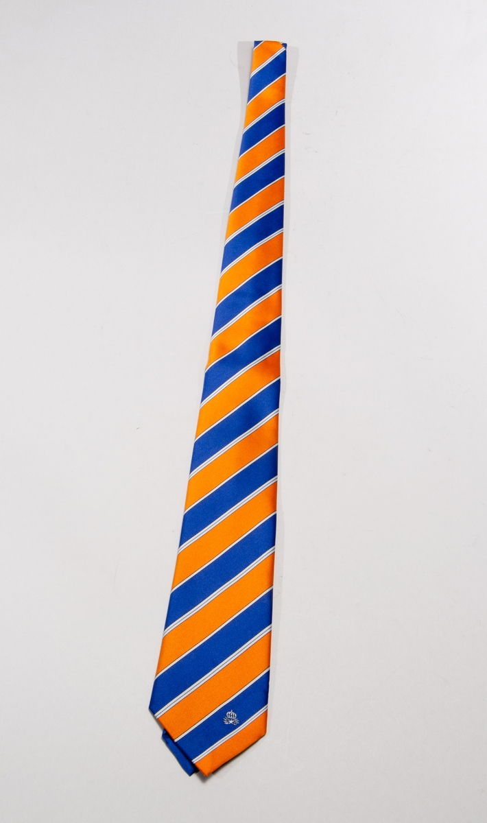 Snedrandig slips av polyestermaterial, i blått/orange med televerkets emblem påbroderat, i plastfodral.