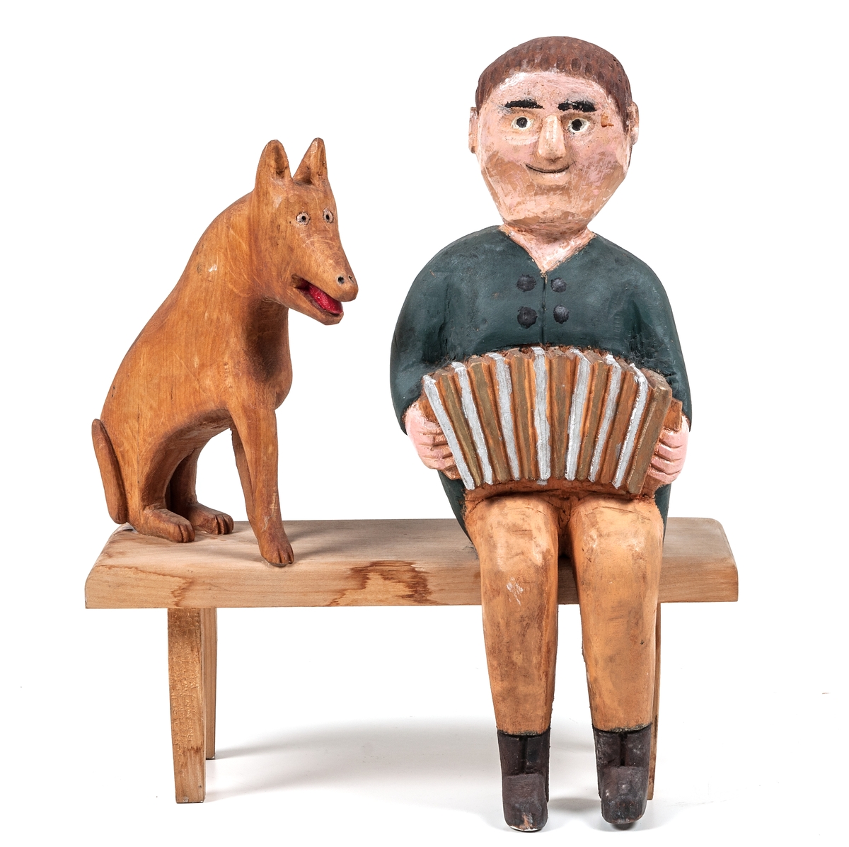 Träskulptur "Dragspelare" av Per Mörk. Skulpturen består av sittande dragspelare och sittande hund på träbänk.