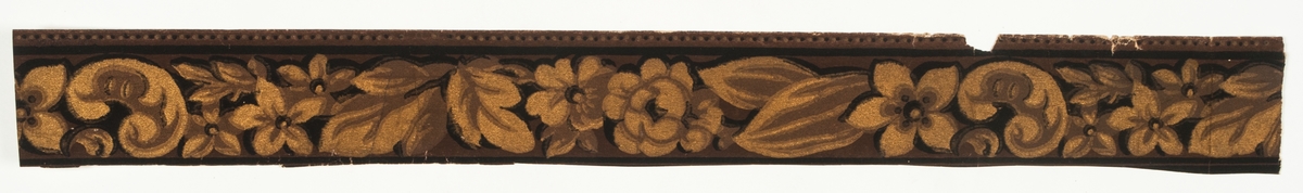 Tapetbård med kraftfullt tecknad blomstergirland i brunt, svart och bronsfärg i två nyanser.'
