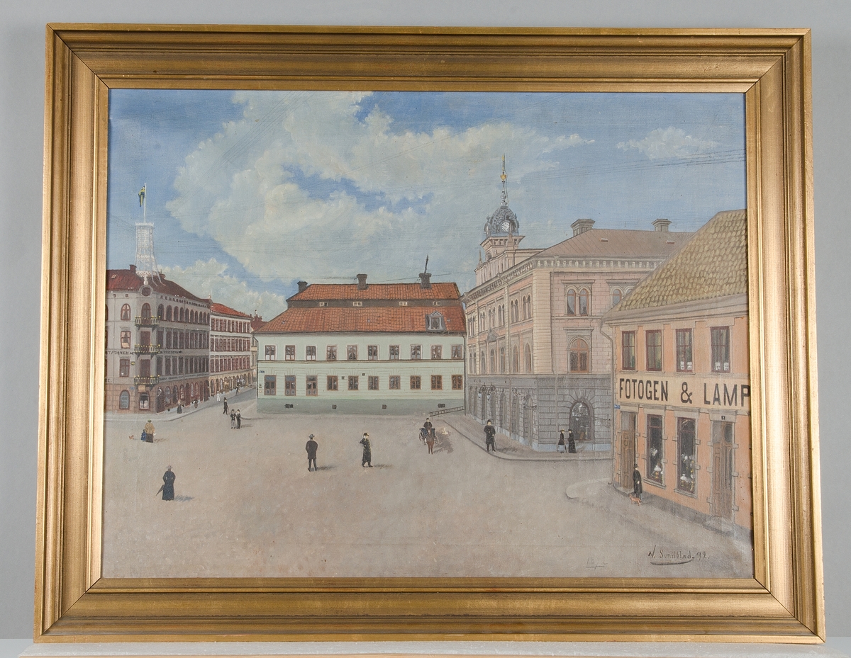 Stora Torget, Uppsala omkring 1892. Motivet är bland annat  Rådhuset och människor som promenerar över det ganska tomma torget.