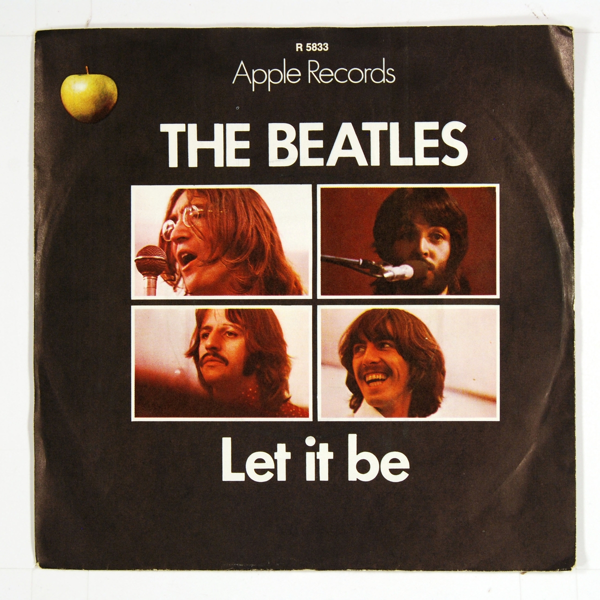 Rutenett med bilde av hvert av medlemmene i "The Beatles" på coveret. Plateetiketten viser et grønt eple på A-siden og et delt eple på B-siden.