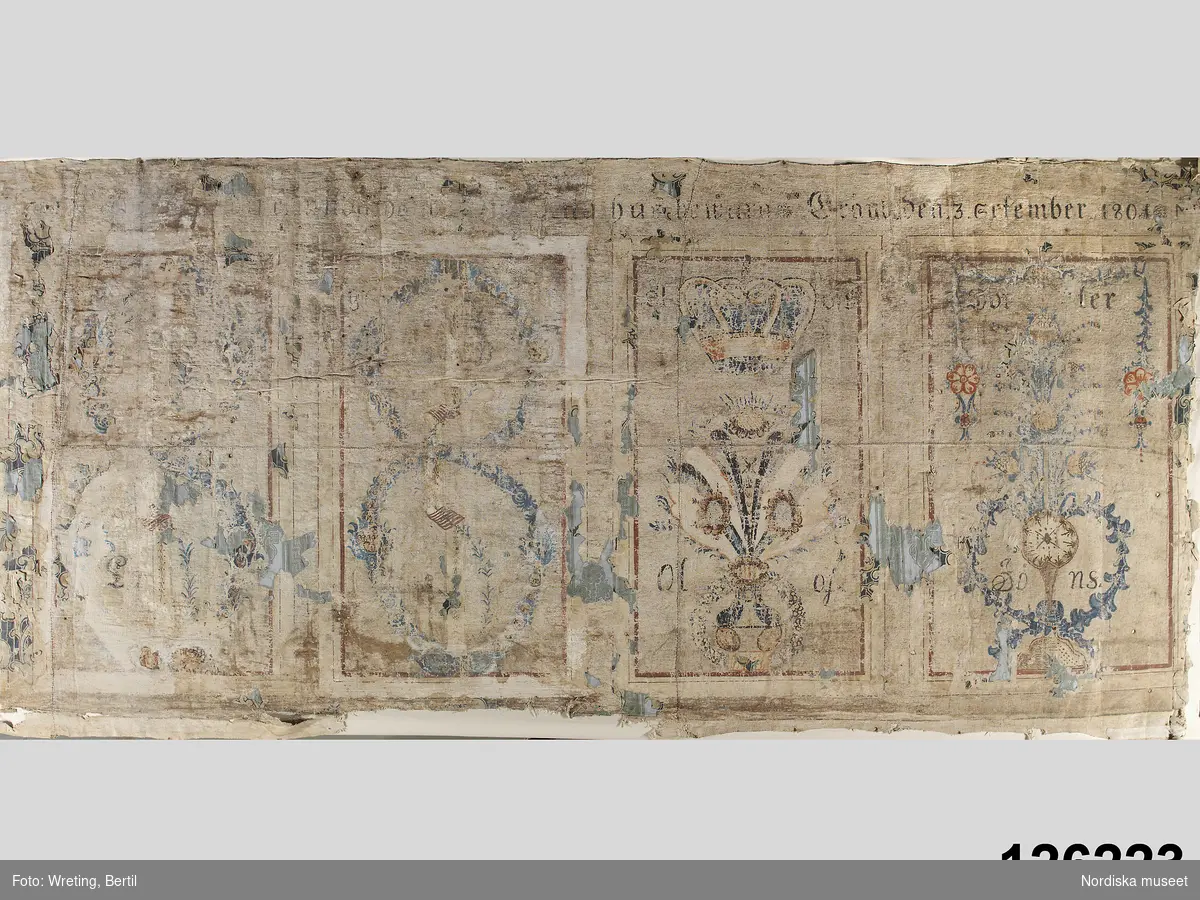 Huvudliggaren:
"Bonad, målad på våv i matta färger, med lång inskrift, dat. 1801. Från Gränby by."