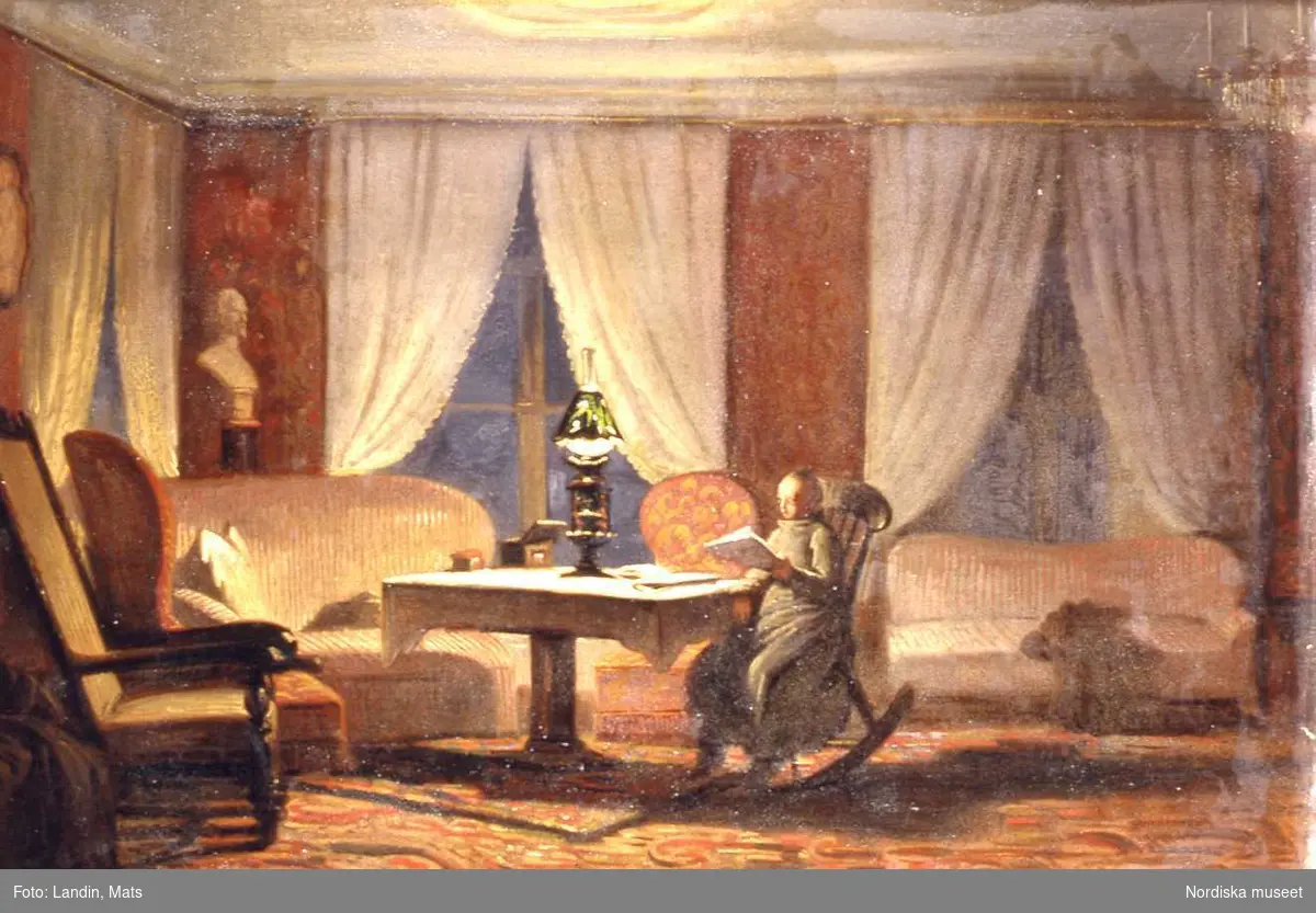 Salongsinteriör, oljemålning på duk, dam i gungstol, brinnande lampa på bordet; sign J Z Blackstadius 1850. Nordiska museet inv.nr 219693