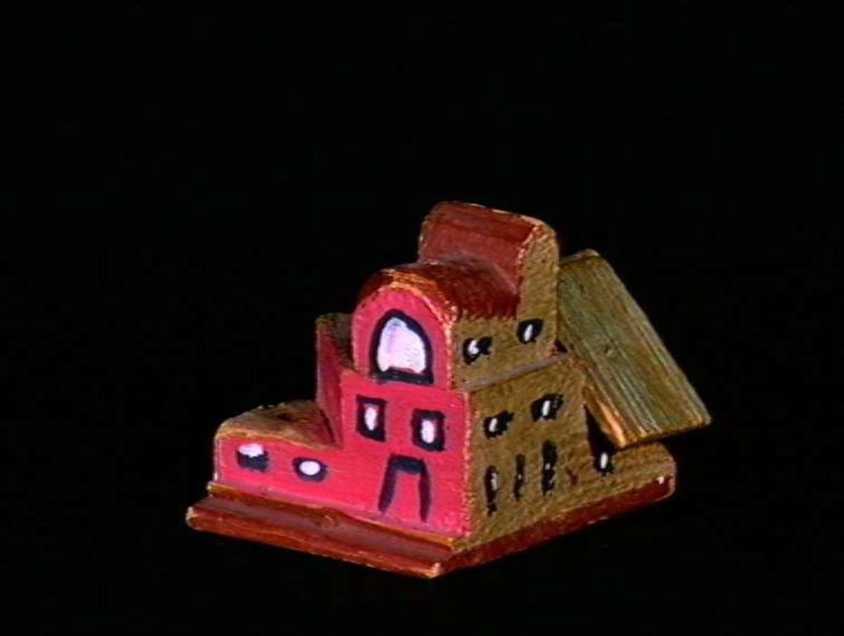 Sett med ca 200 leketøyhus laget av tre i forskjellige former og farger.